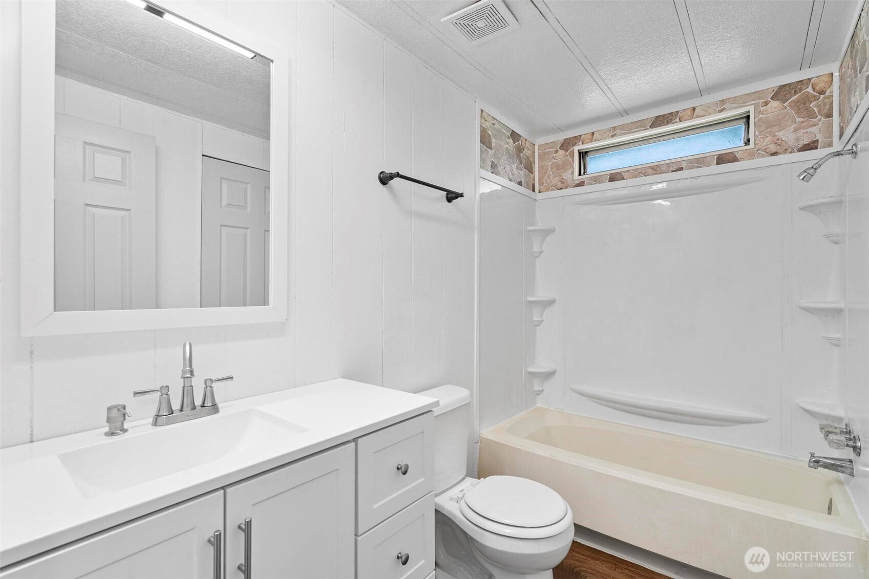 8826 183rd Avenue Southwest Rochester, WA 98579 - Photo 13 of 31 a bathroom with a sink a toilet and shower