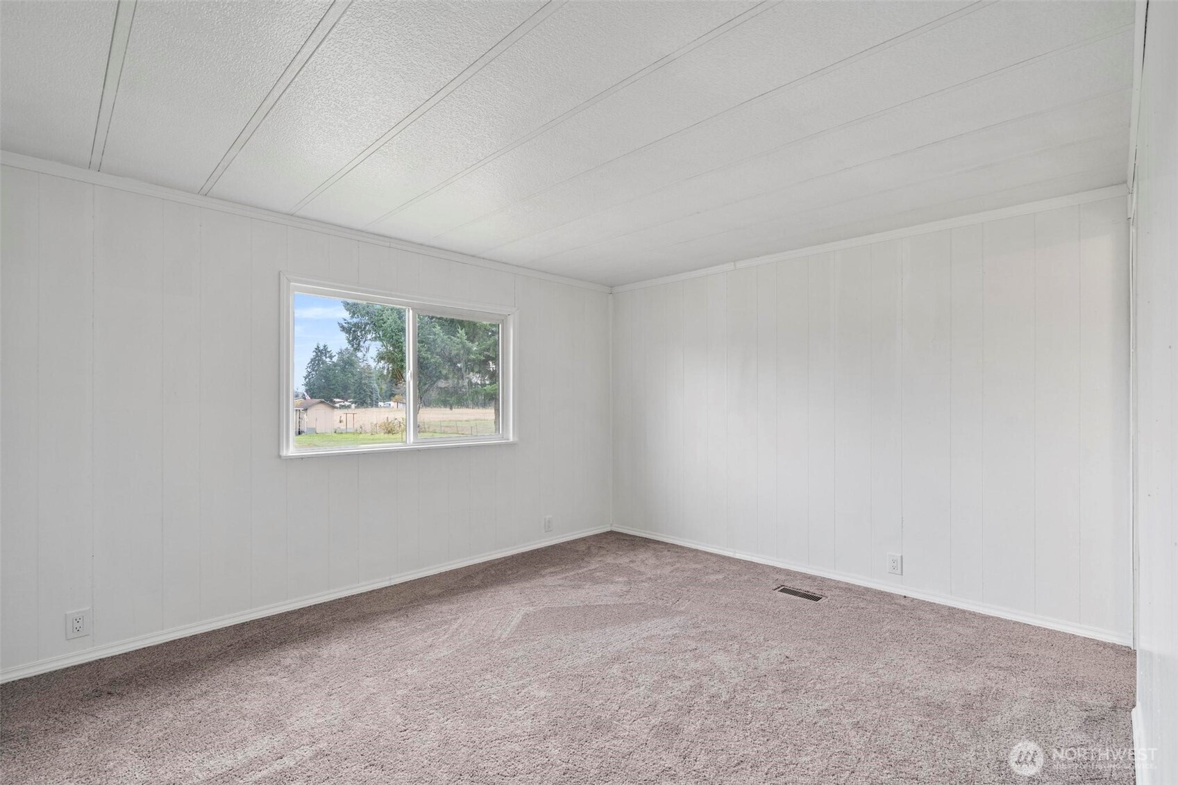 8826 183rd Avenue Southwest Rochester, WA 98579 - Photo 17 of 31 an empty room with a window