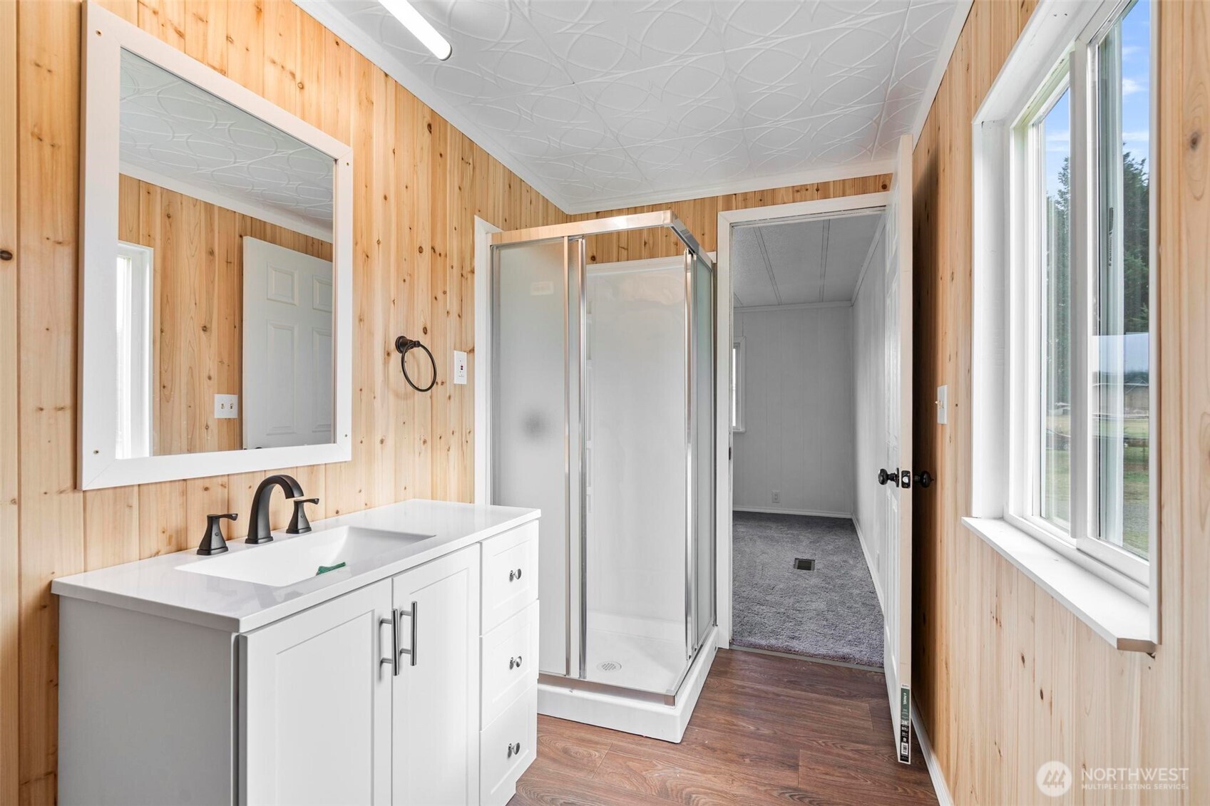 8826 183rd Avenue Southwest Rochester, WA 98579 - Photo 19 of 31 a bathroom with a sink and a mirror