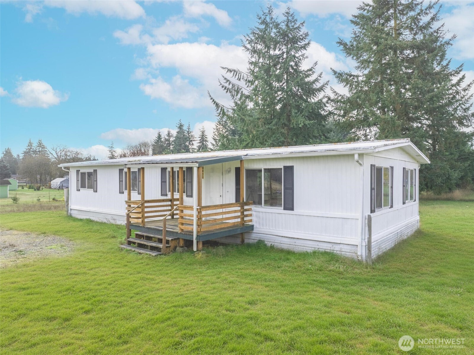 8826 183rd Avenue Southwest Rochester, WA 98579 - Photo 21 of 31 a front view of house with yard and seating area