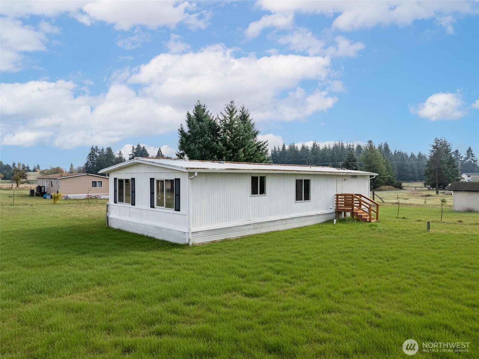 8826 183rd Avenue Southwest Rochester, WA 98579 - Photo 22 of 31 a view of a house with a yard