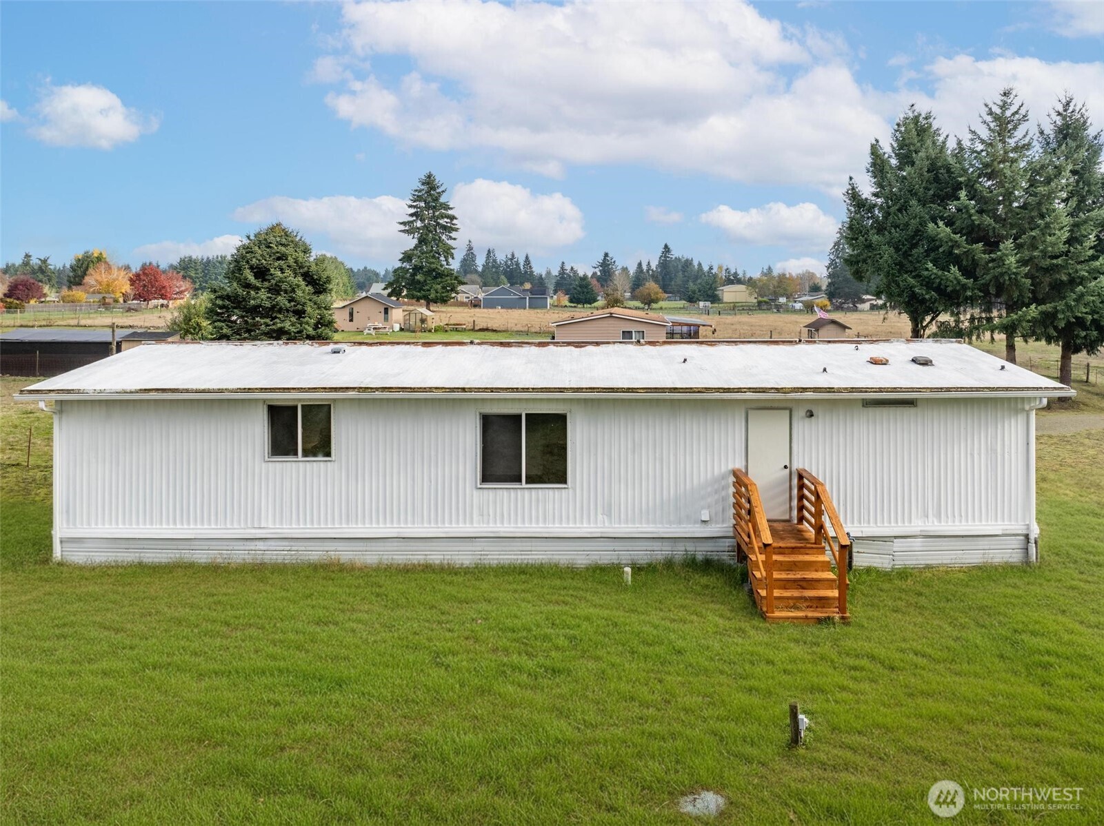 8826 183rd Avenue Southwest Rochester, WA 98579 - Photo 24 of 31 a front view of a house with a yard