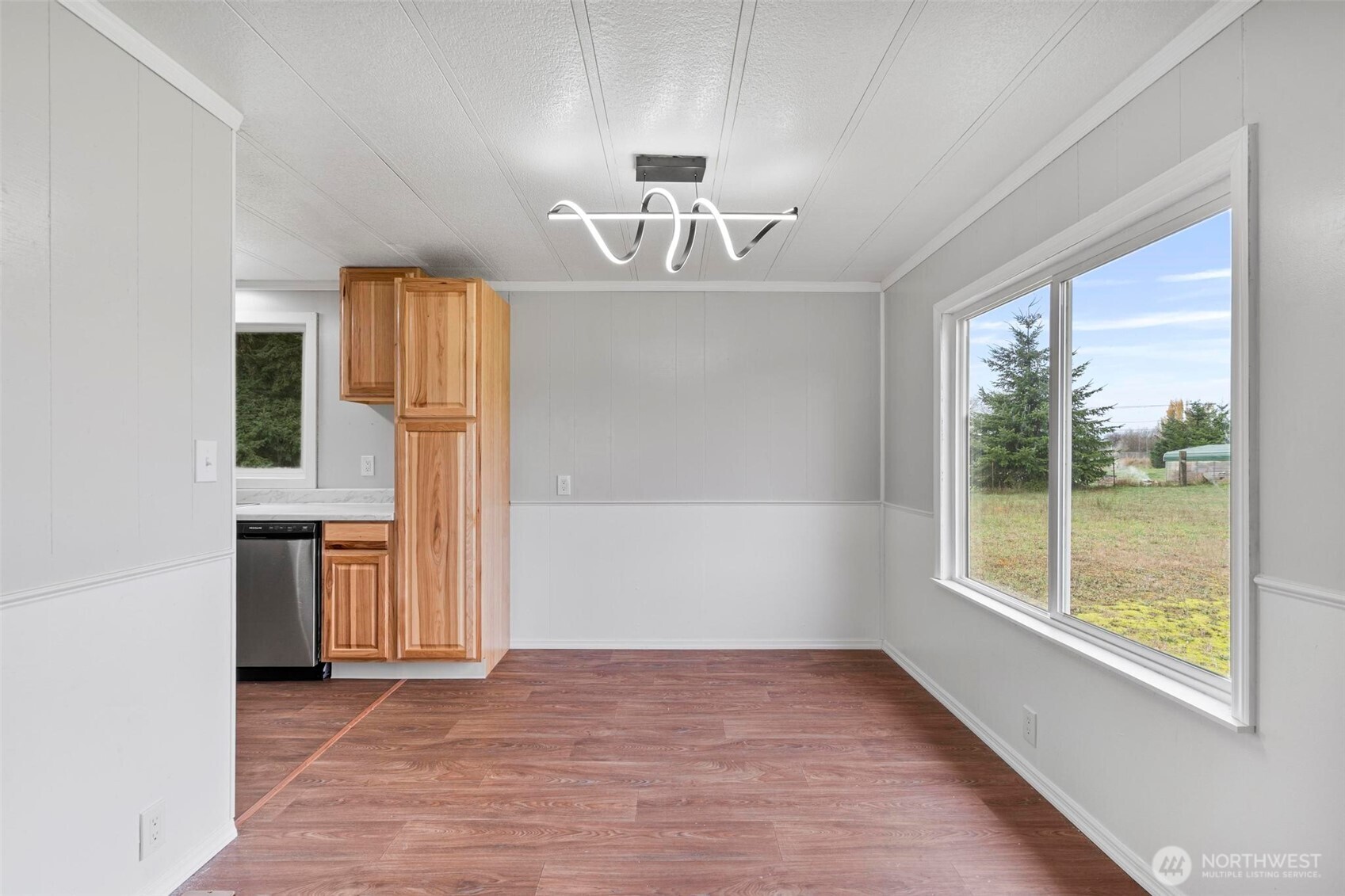 8826 183rd Avenue Southwest Rochester, WA 98579 - Photo 4 of 31 an empty room with windows