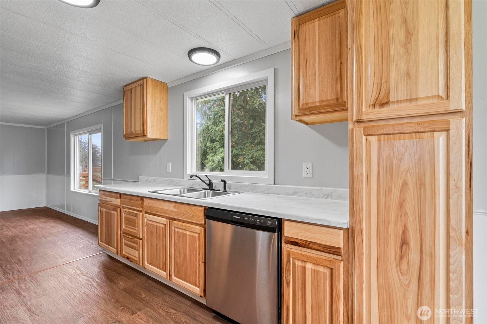 8826 183rd Avenue Southwest Rochester, WA 98579 - Photo 6 of 31 a kitchen with stainless steel appliances granite countertop a sink and a window