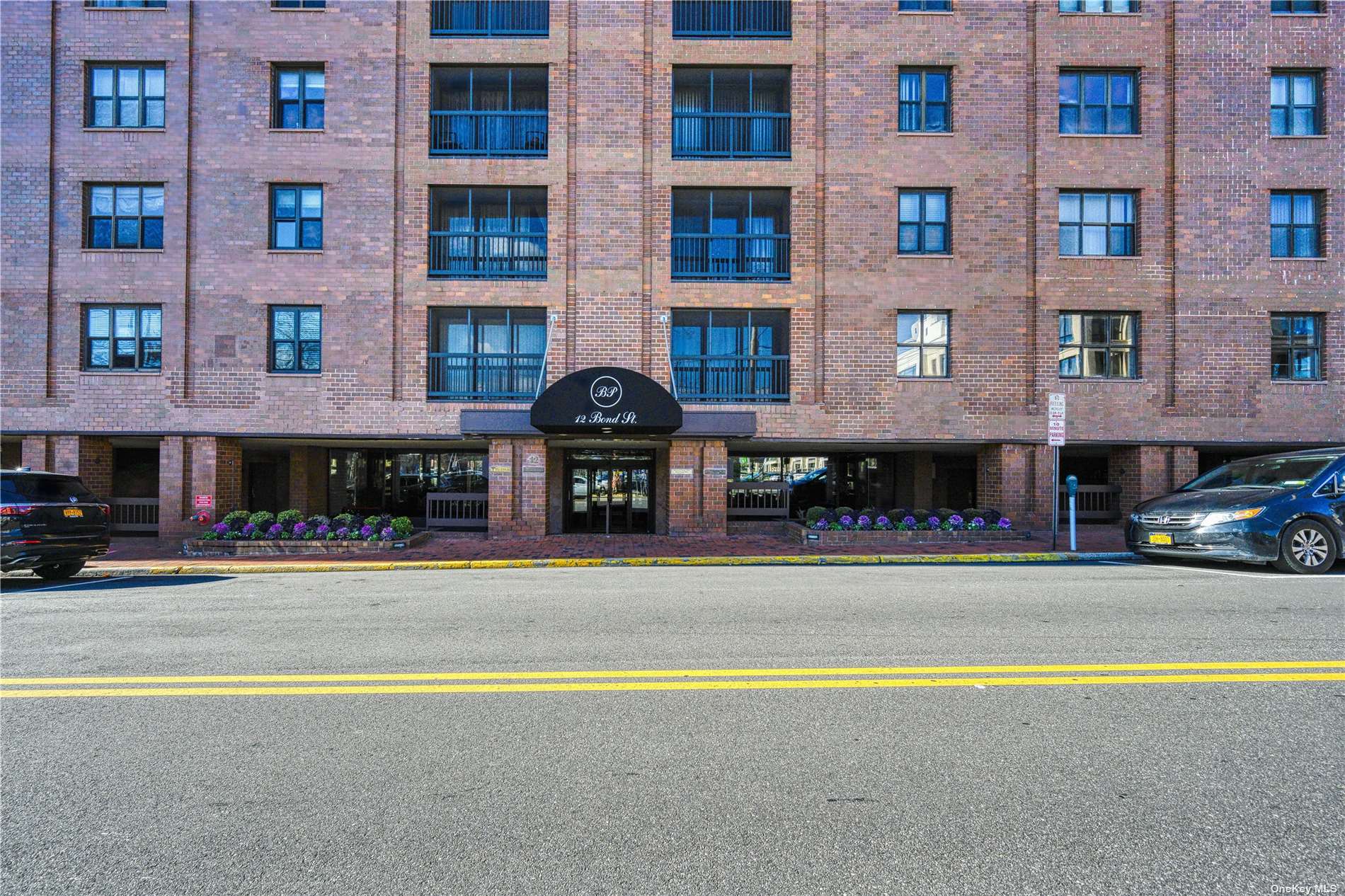 12 Bond Street, Unit 7E Great Neck, NY 11021 - Photo 1 of 1 a view of a building with a swimming pool