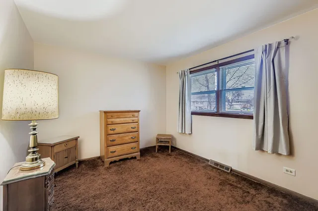 a view of room with window and a flat screen tv