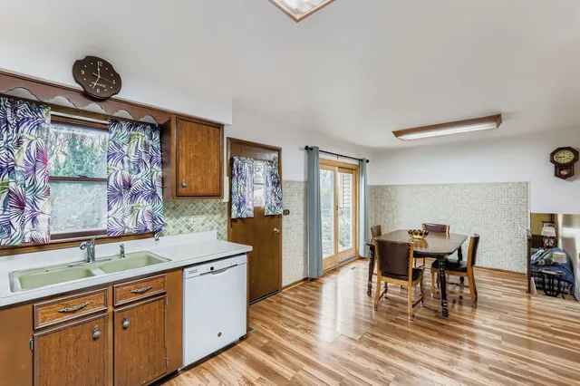 a view of a dining room with furniture and window
