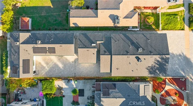 an aerial view of houses with outdoor space