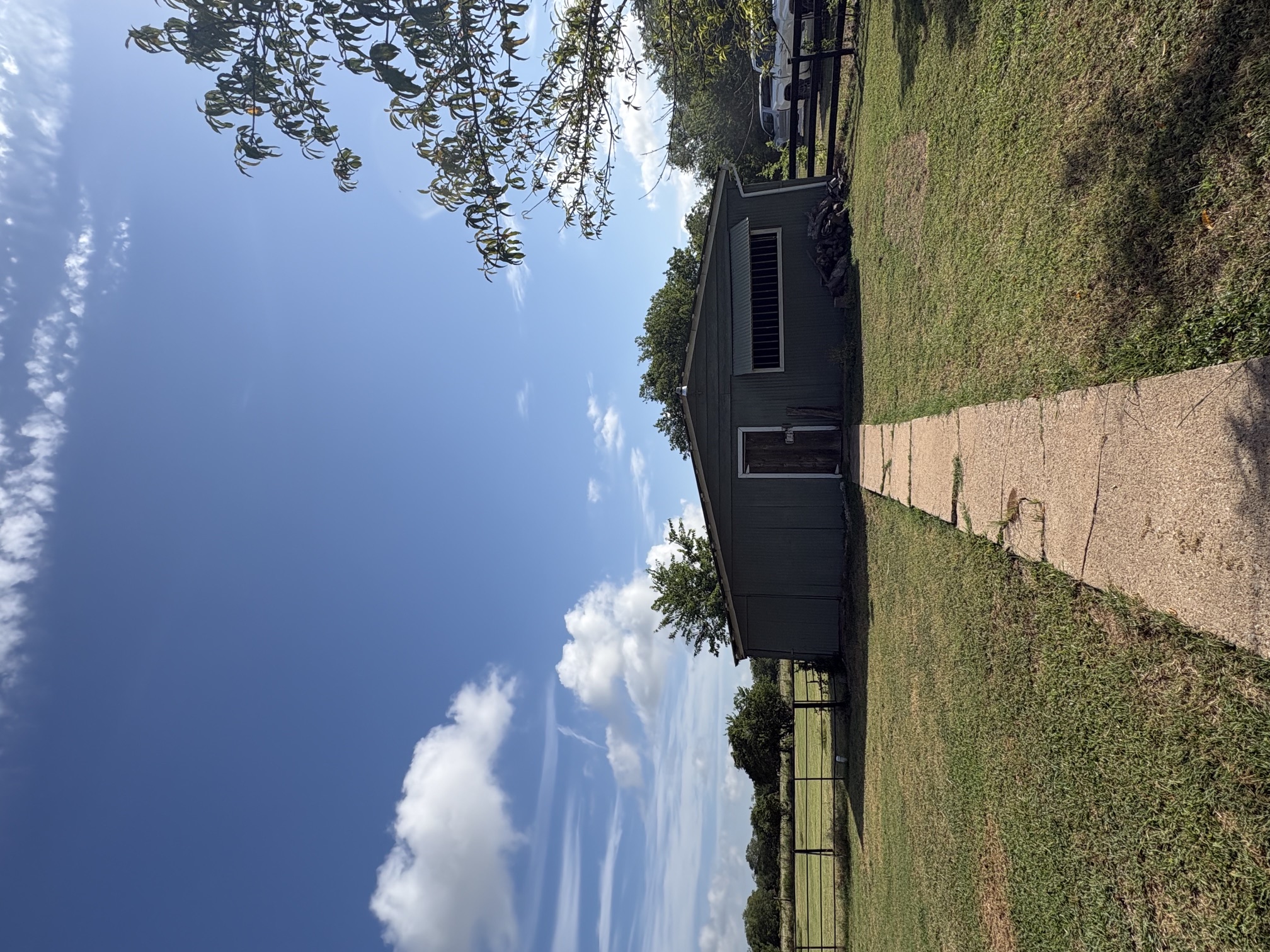 9032 Nuckols Crossing Road Austin, TX 78744 - Photo 12 of 14 A large workshop and storage shed offers functional utility amidst a generous, verdant landscape perfect for anything you can imagine, Gym, workshop, personal training space, mediation space, etc....