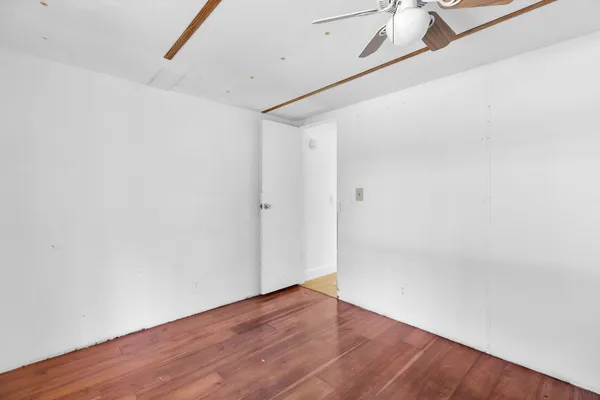 a bathroom with a sink toilet and mirror