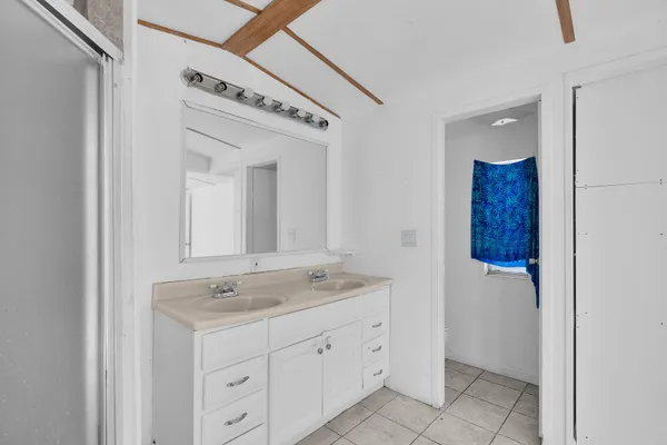 a view of a livingroom with a ceiling fan and window