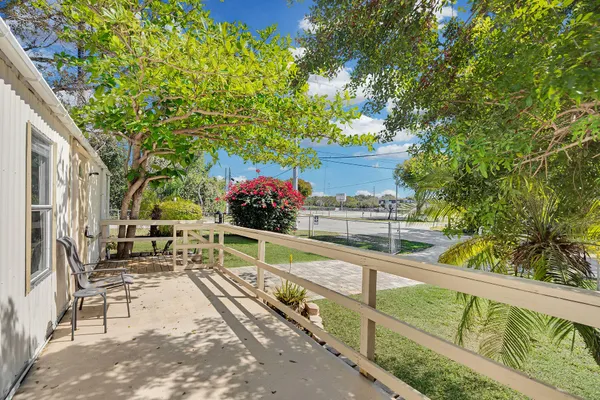 a view of balcony with two potted plants