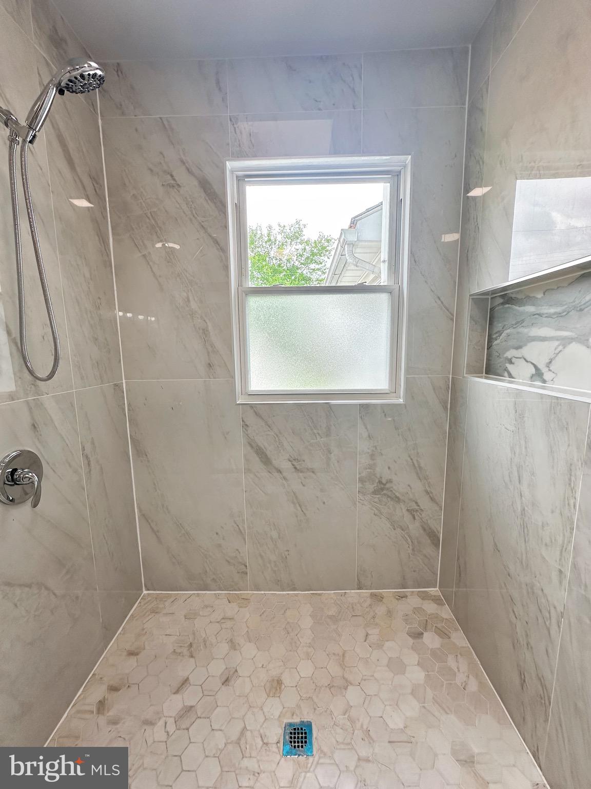 603 Brookwood Road Baltimore, MD 21229 - Photo 13 of 33 a bathroom with a shower