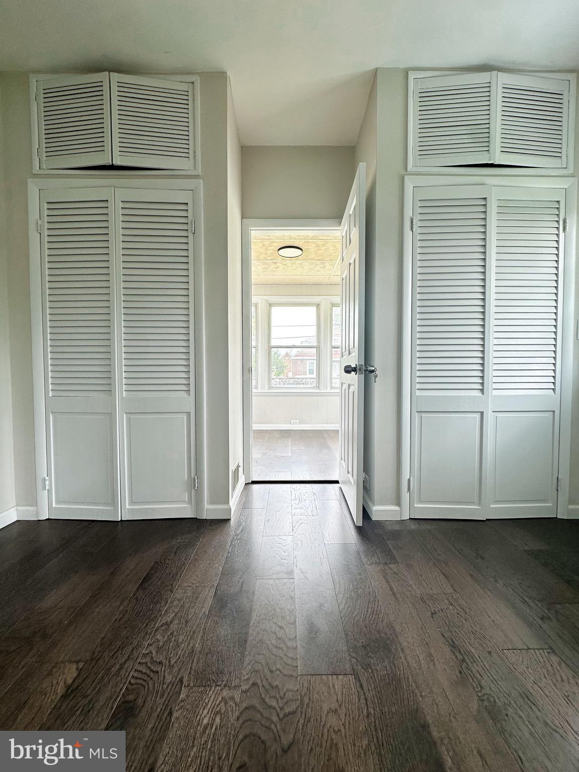603 Brookwood Road Baltimore, MD 21229 - Photo 17 of 33 an empty room with wooden floor and closet