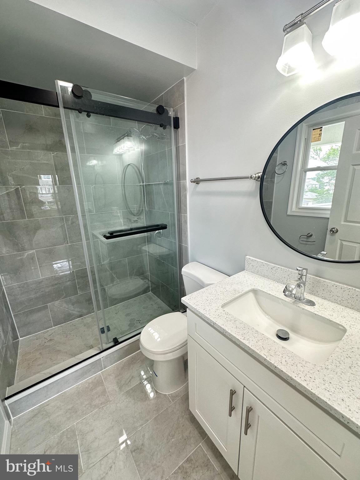 603 Brookwood Road Baltimore, MD 21229 - Photo 22 of 33 a bathroom with a sink toilet and shower