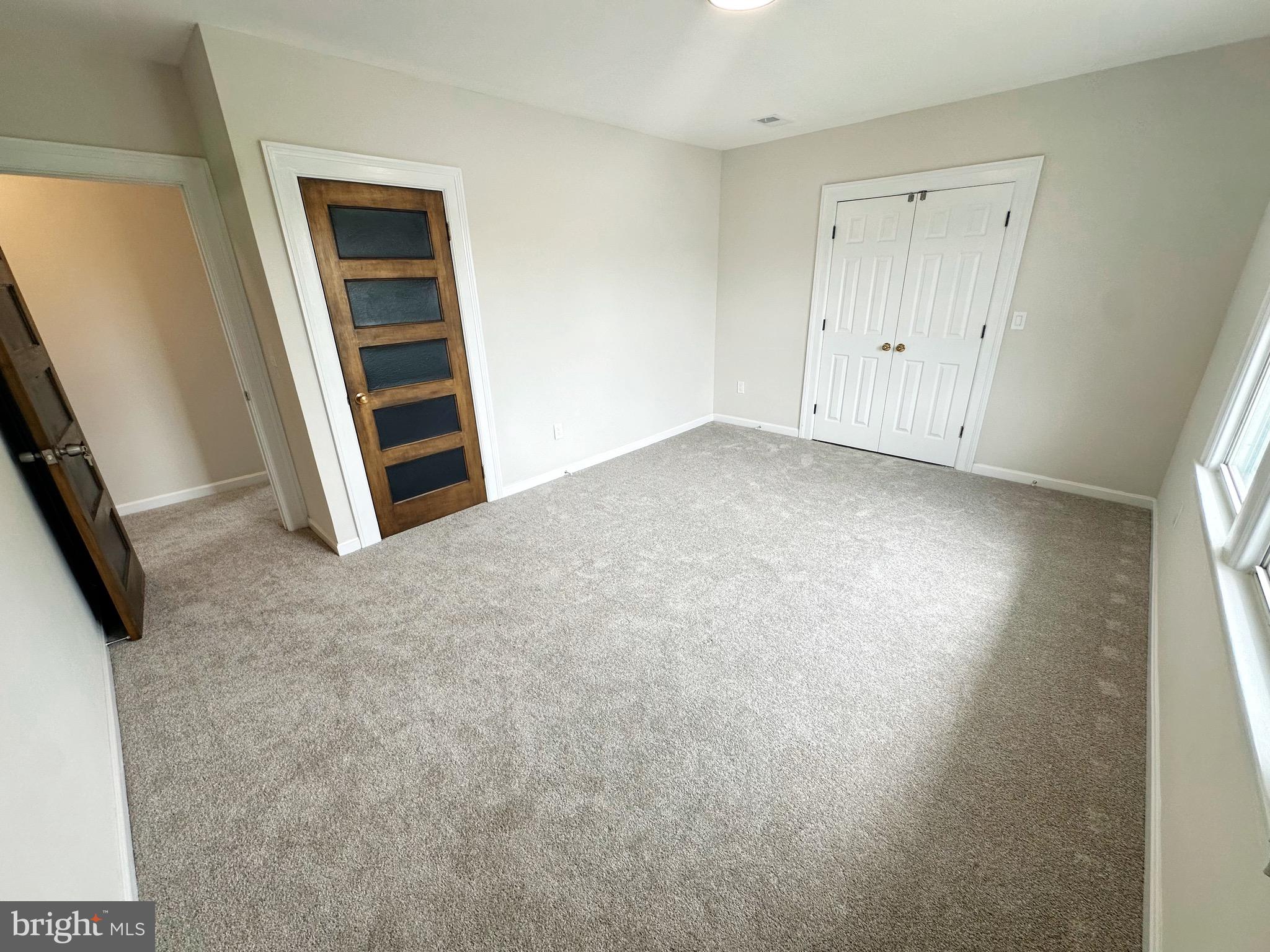 603 Brookwood Road Baltimore, MD 21229 - Photo 23 of 33 an empty room with windows