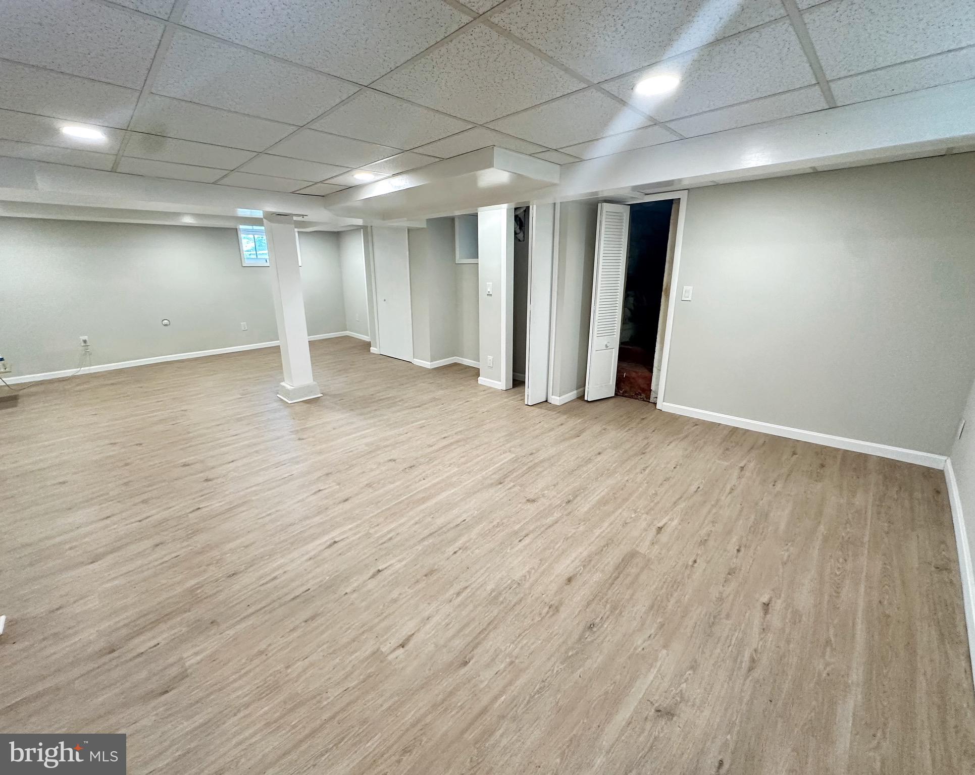 603 Brookwood Road Baltimore, MD 21229 - Photo 27 of 33 an empty room with wooden floor and closet