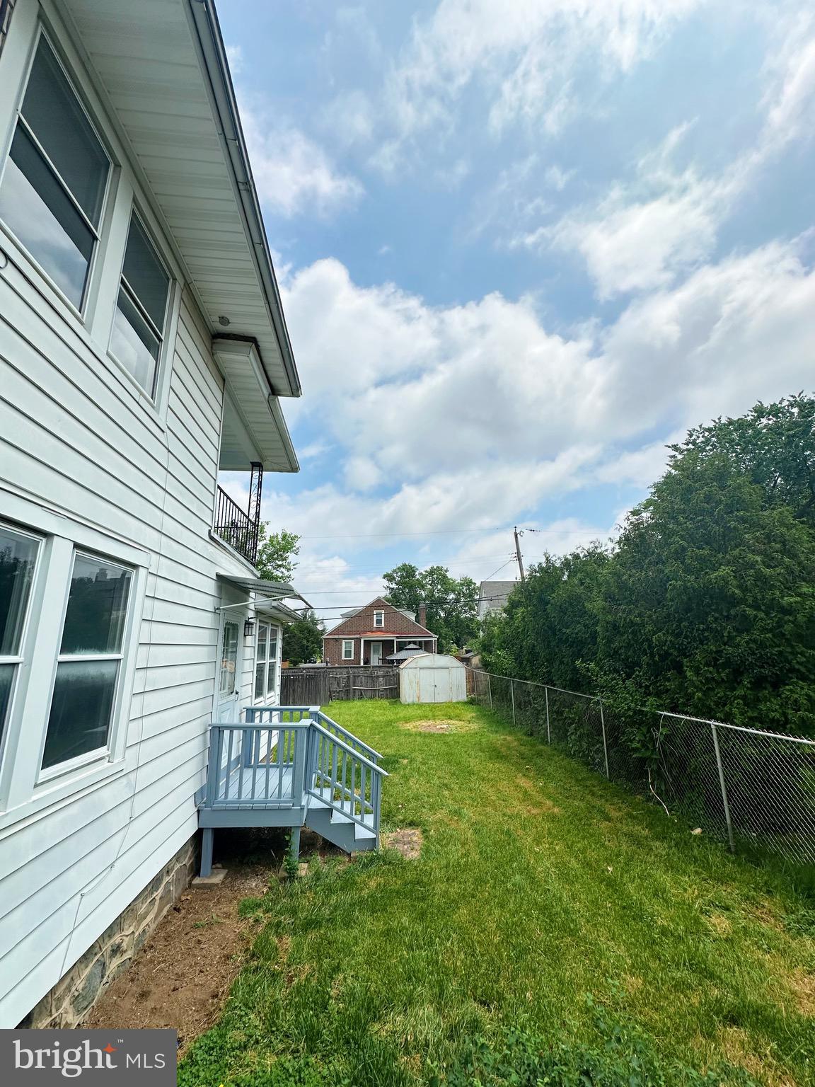 603 Brookwood Road Baltimore, MD 21229 - Photo 31 of 33 a view of a porch with a yard