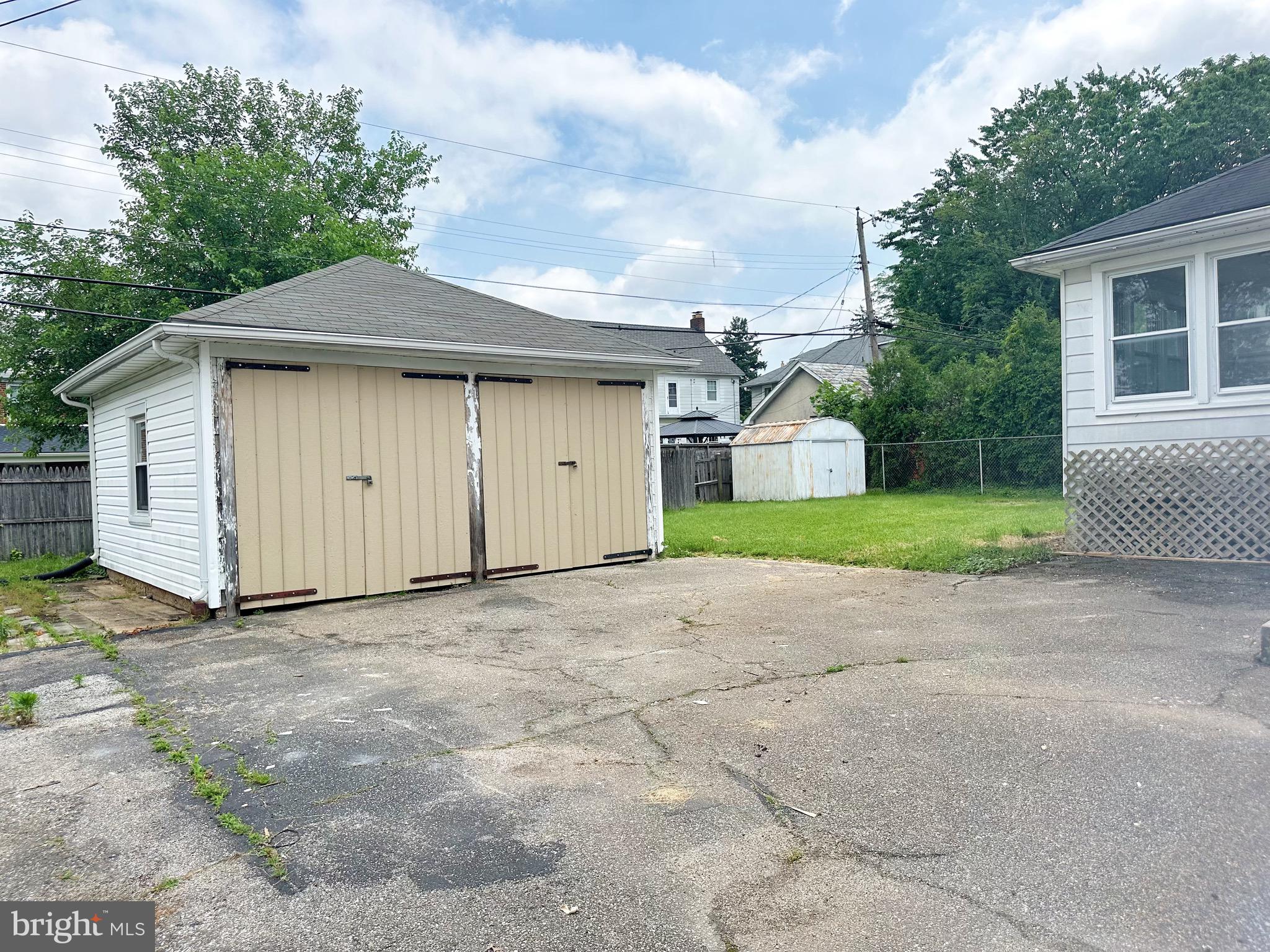 603 Brookwood Road Baltimore, MD 21229 - Photo 33 of 33 a view of a house with a yard and garage