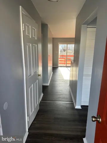 a view of a hallway with windows