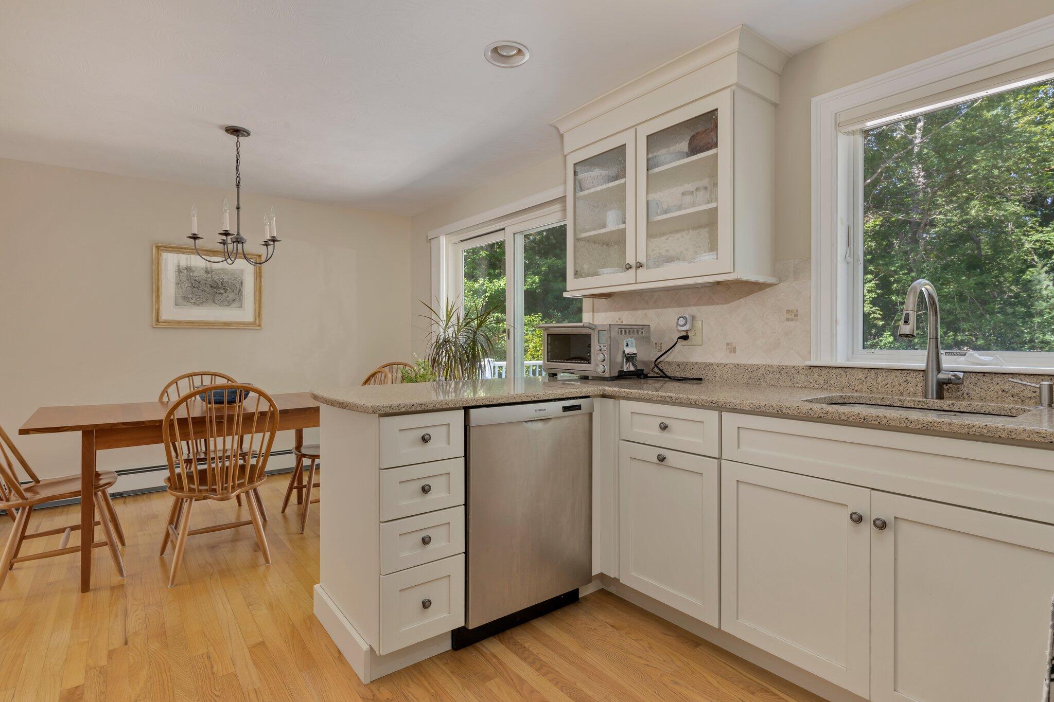 79 Mountwood Road Marstons Mills, MA 02648 - Photo 15 of 33 a kitchen with cabinets appliances and a window