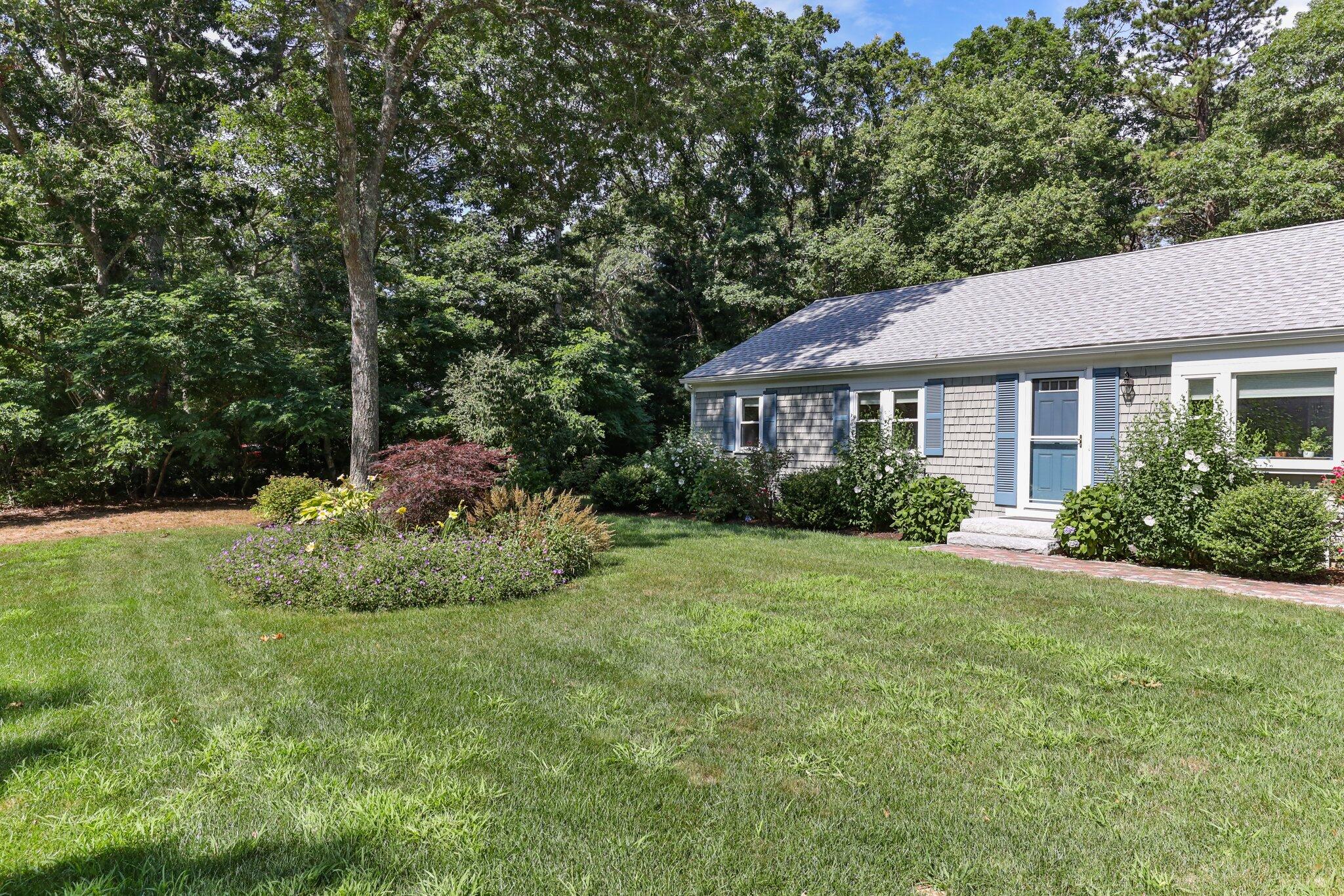 79 Mountwood Road Marstons Mills, MA 02648 - Photo 4 of 33 a view of a house with a yard and tree s