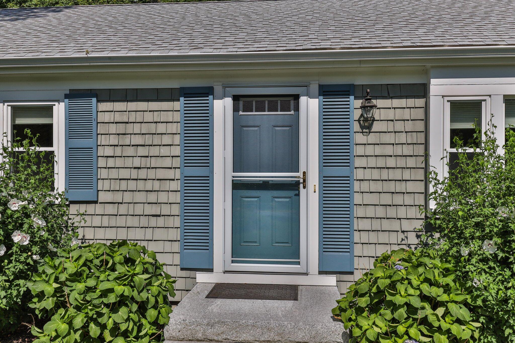 79 Mountwood Road Marstons Mills, MA 02648 - Photo 5 of 33 a front view of a house with garden