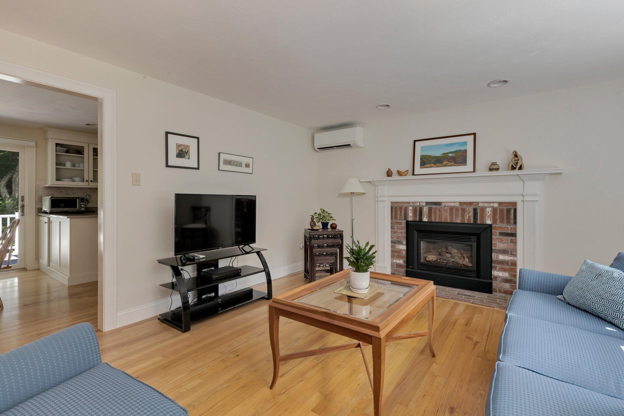 79 Mountwood Road Marstons Mills, MA 02648 - Photo 7 of 33 a living room with furniture and a fireplace