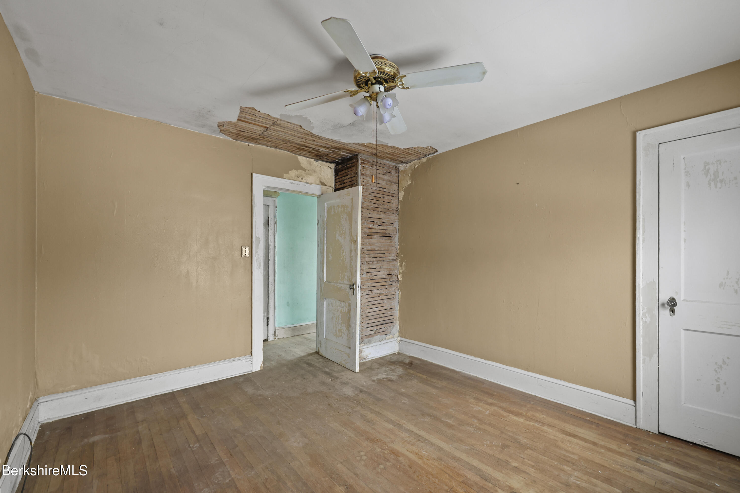 21 Ensign Avenue Pittsfield, MA 01201 - Photo 18 of 33 a view of a room with a ceiling fan wooden floor and a ceiling fan