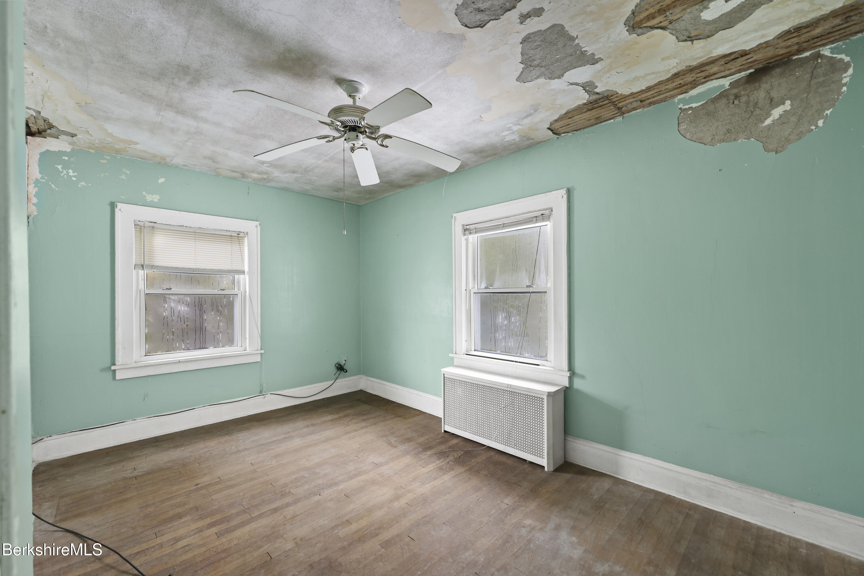 21 Ensign Avenue Pittsfield, MA 01201 - Photo 19 of 33 an empty room with windows and fan