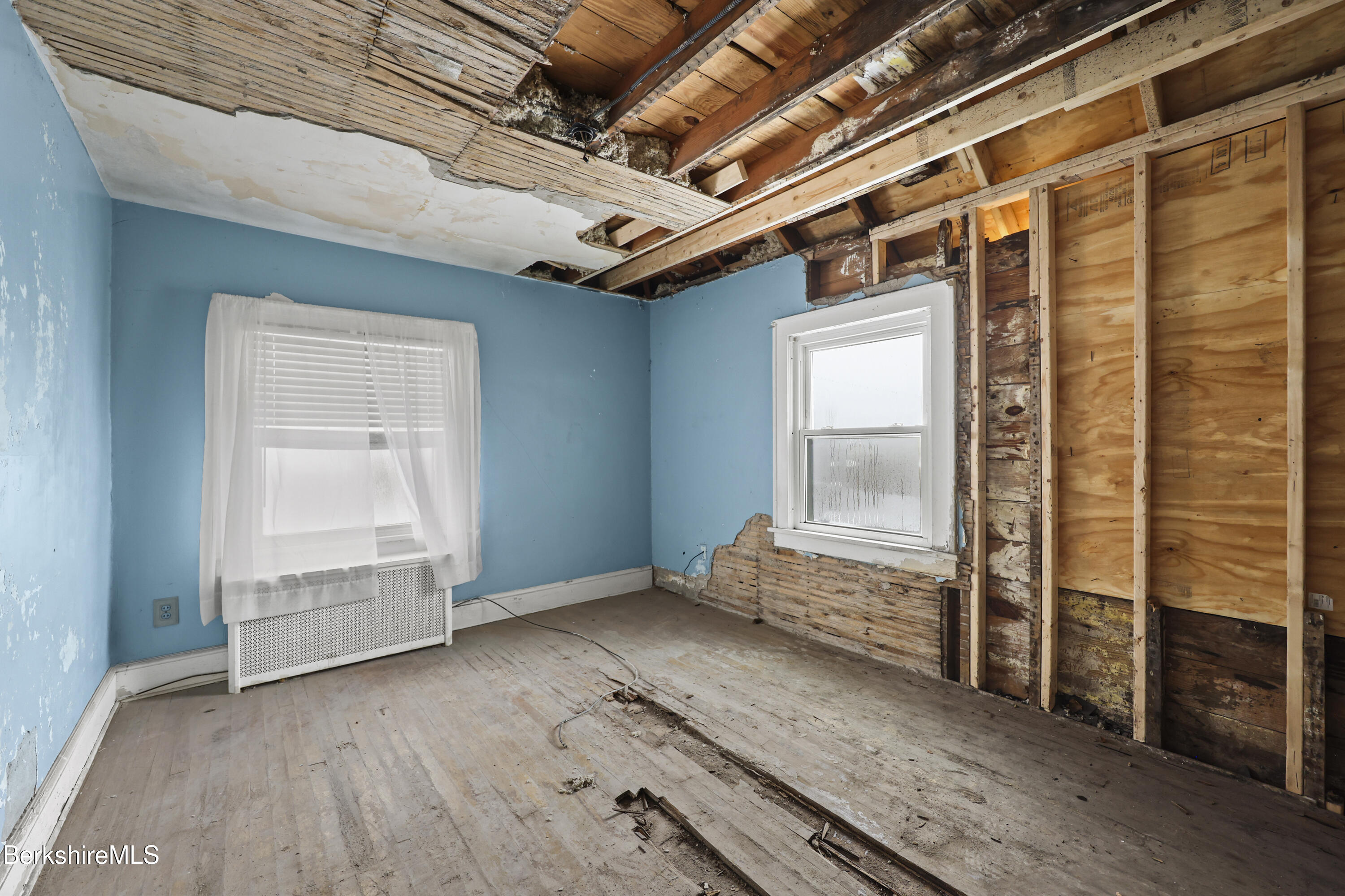 21 Ensign Avenue Pittsfield, MA 01201 - Photo 21 of 33 a view of an empty room with wooden floor and a window