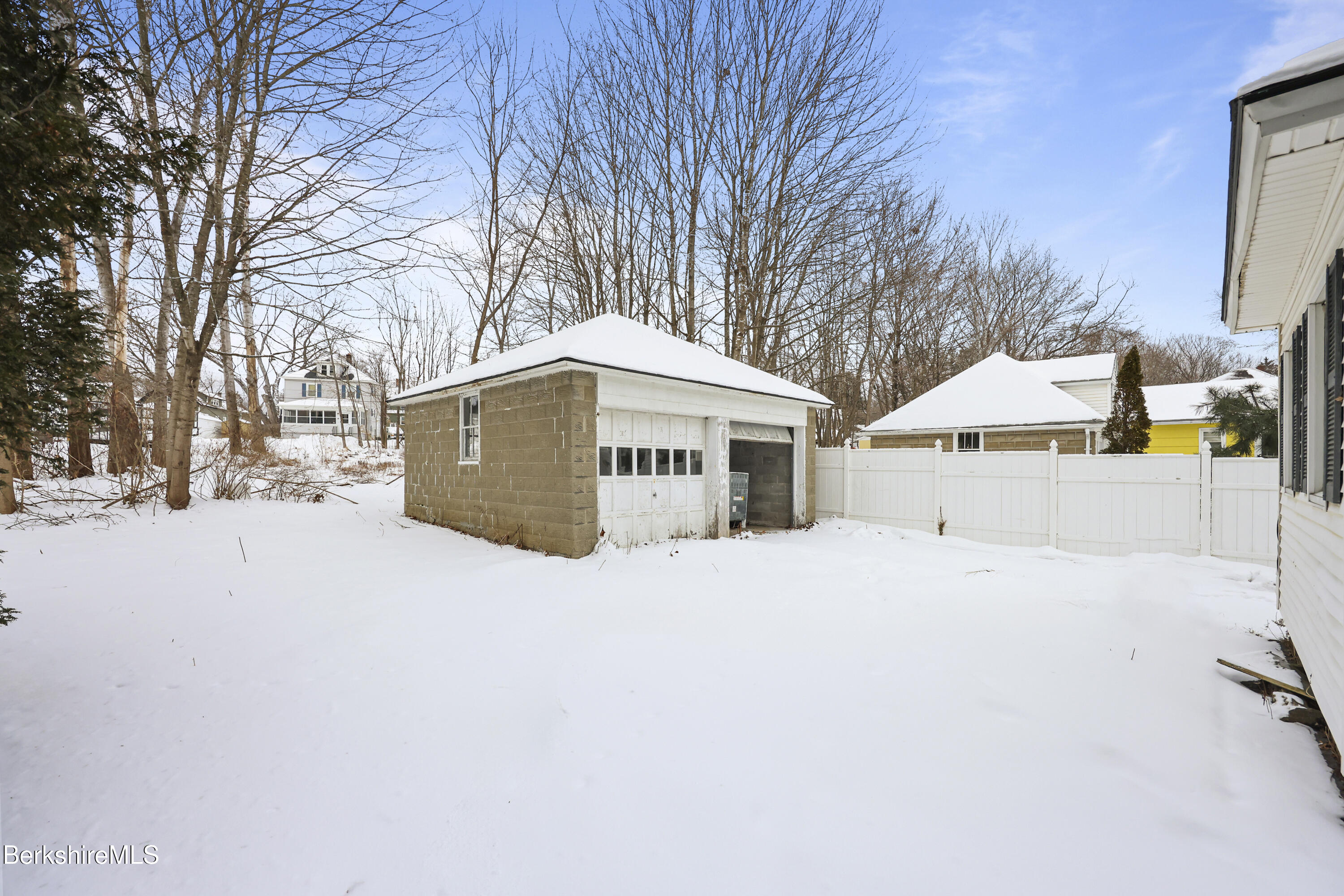21 Ensign Avenue Pittsfield, MA 01201 - Photo 27 of 33 a house with trees in front of it