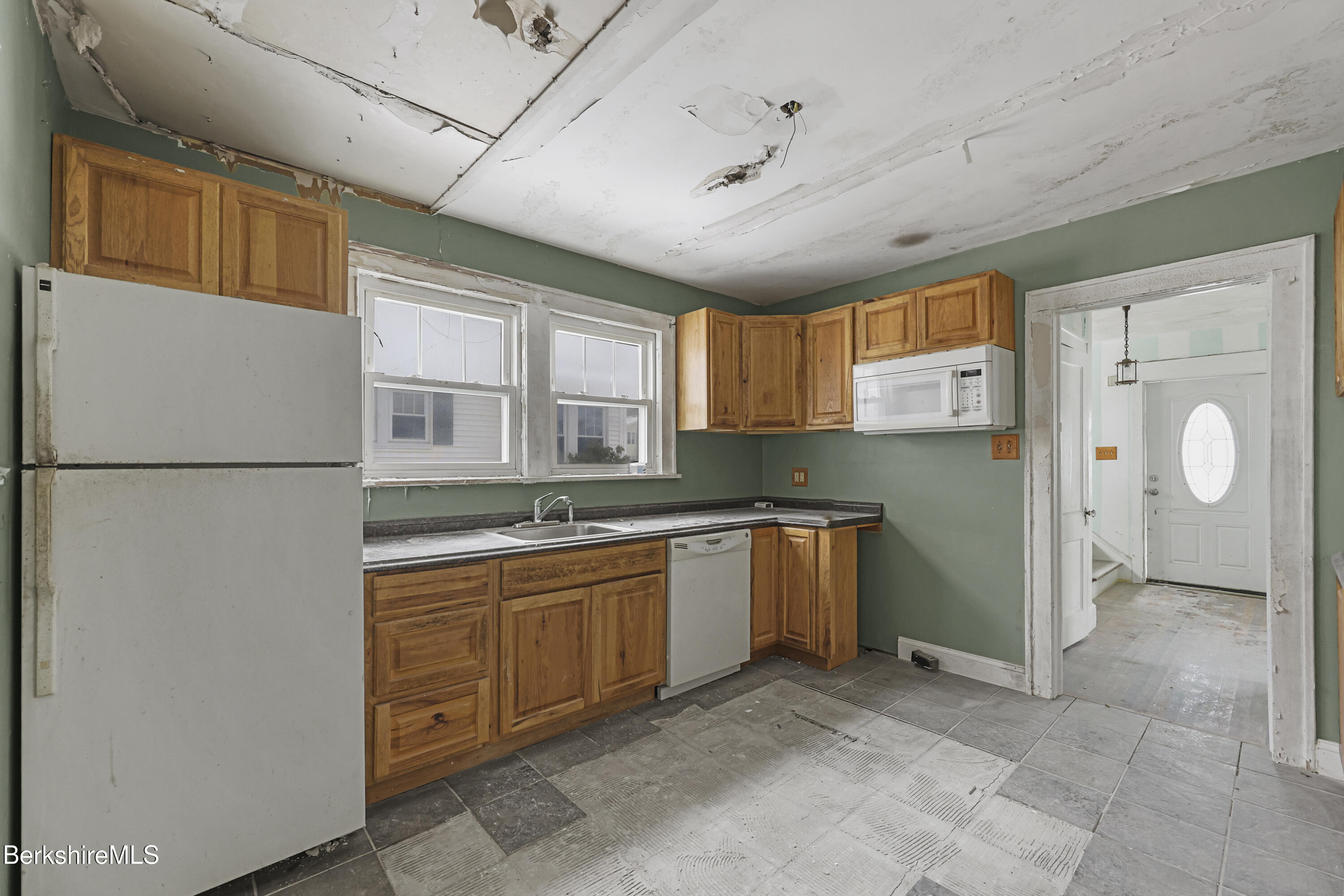 21 Ensign Avenue Pittsfield, MA 01201 - Photo 5 of 33 a kitchen with stainless steel appliances granite countertop a refrigerator and a sink