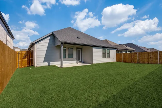 a view of a house with a big yard