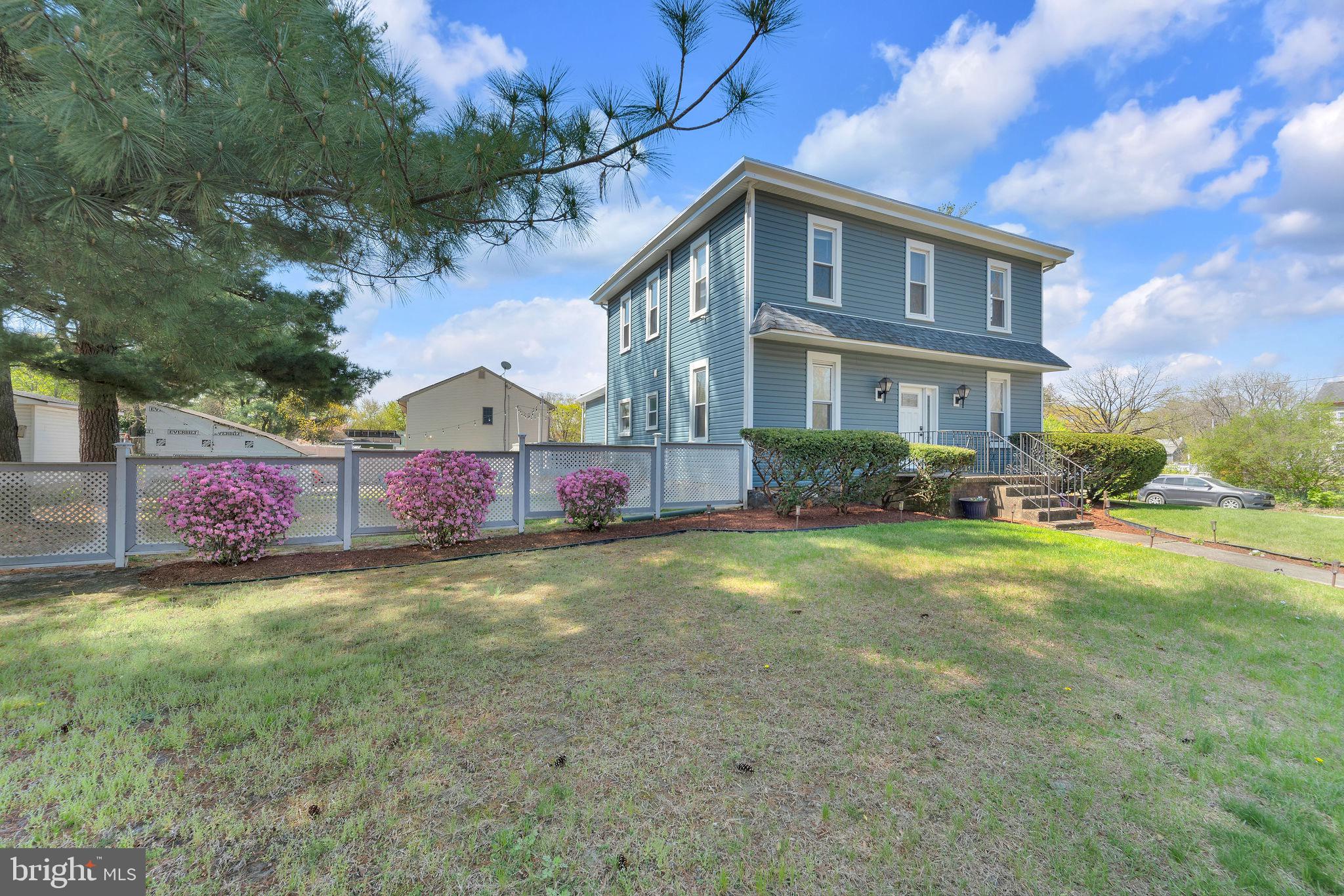 535 Chestnut Avenue Lindenwold, NJ 08021 - Photo 1 of 6 a front view of house with yard and trees in the background