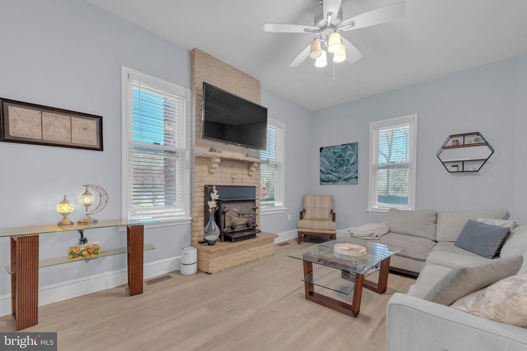 535 Chestnut Avenue Lindenwold, NJ 08021 - Photo 5 of 6 a living room with furniture fireplace and a flat screen tv