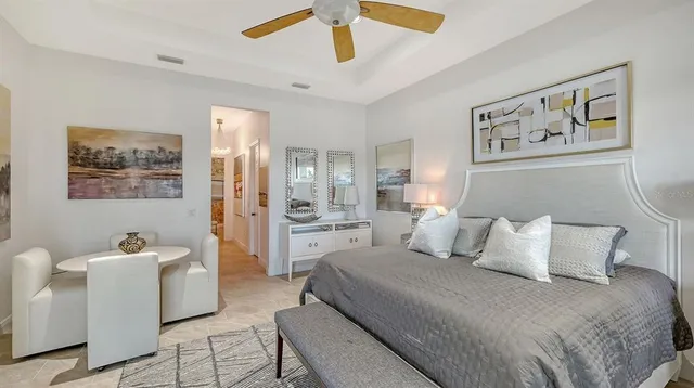 an aerial view of residential houses with outdoor space and lake view