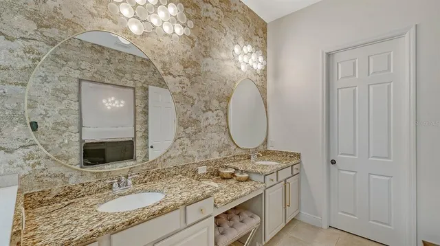 an aerial view of residential houses with outdoor space and lake view