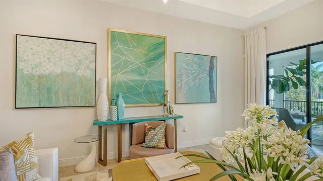 a living room with furniture and a potted plant