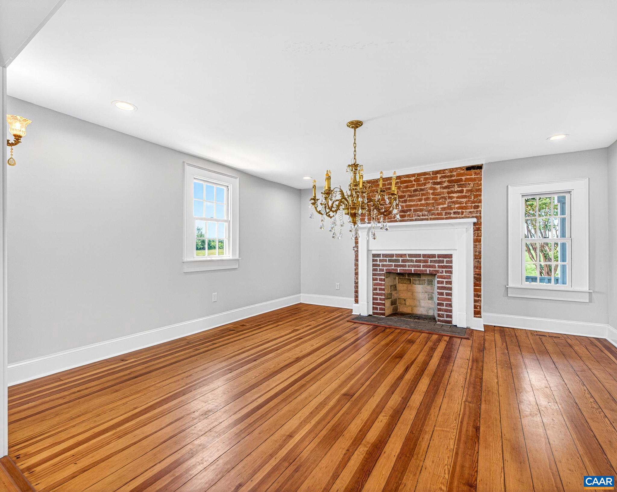 481 Race Ground Road Somerset, VA 22972 - Photo 12 of 53 a view of empty room with wooden floor and fireplace
