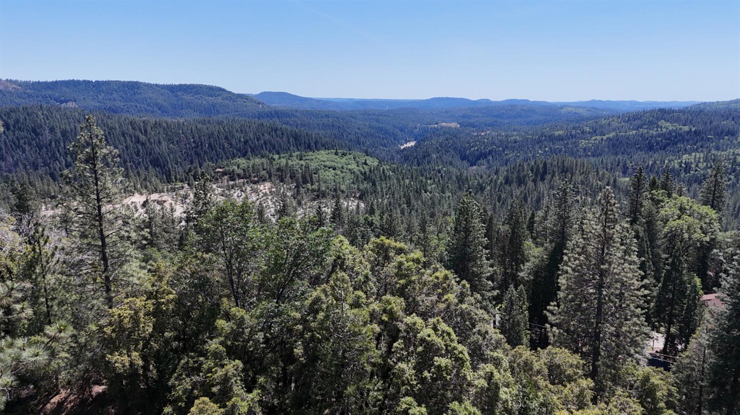 13305 Summit Ridge Drive Nevada City, CA 95959 - Photo 8 of 10 a view of a lush green hillside and a mountain