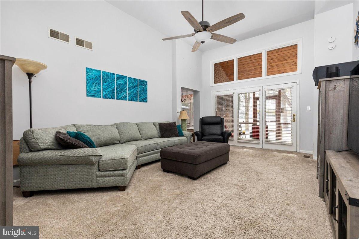 Living room and entrance to screened porch