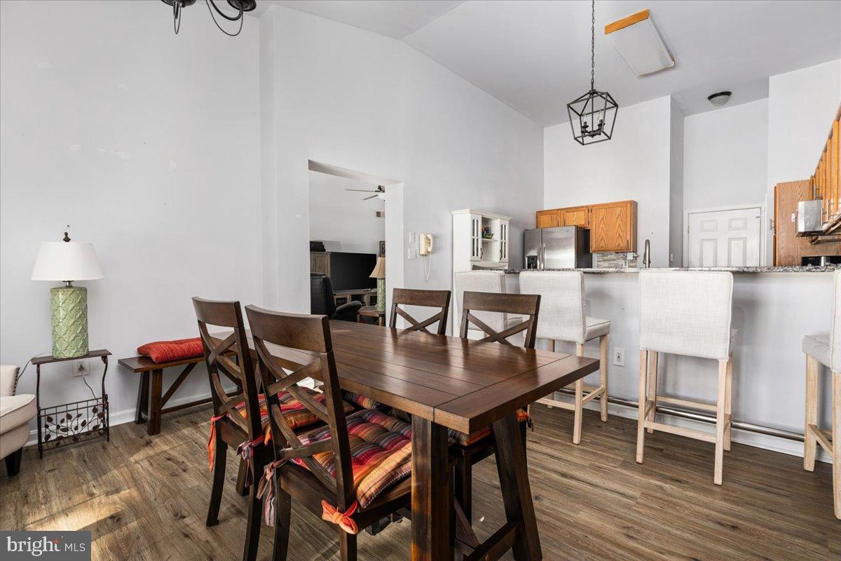 14 Ambler Lane Falling Waters, WV 25419 - Photo 7 of 43 Dining room and large kitchen with vaulted ceiling