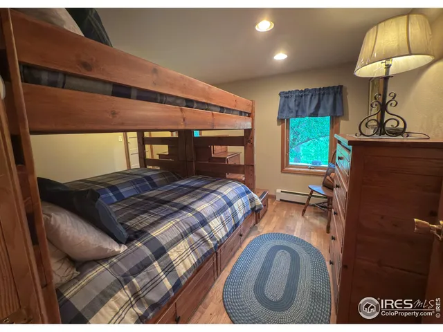 a bedroom with furniture and a dresser