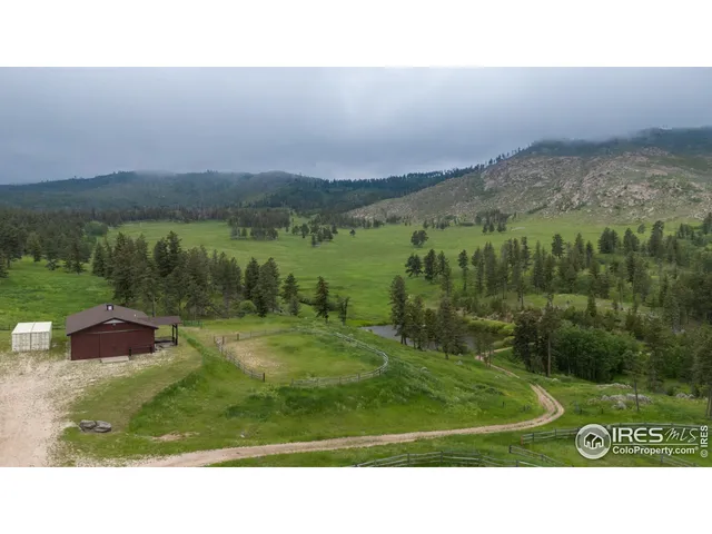 a open area with mountains in the background