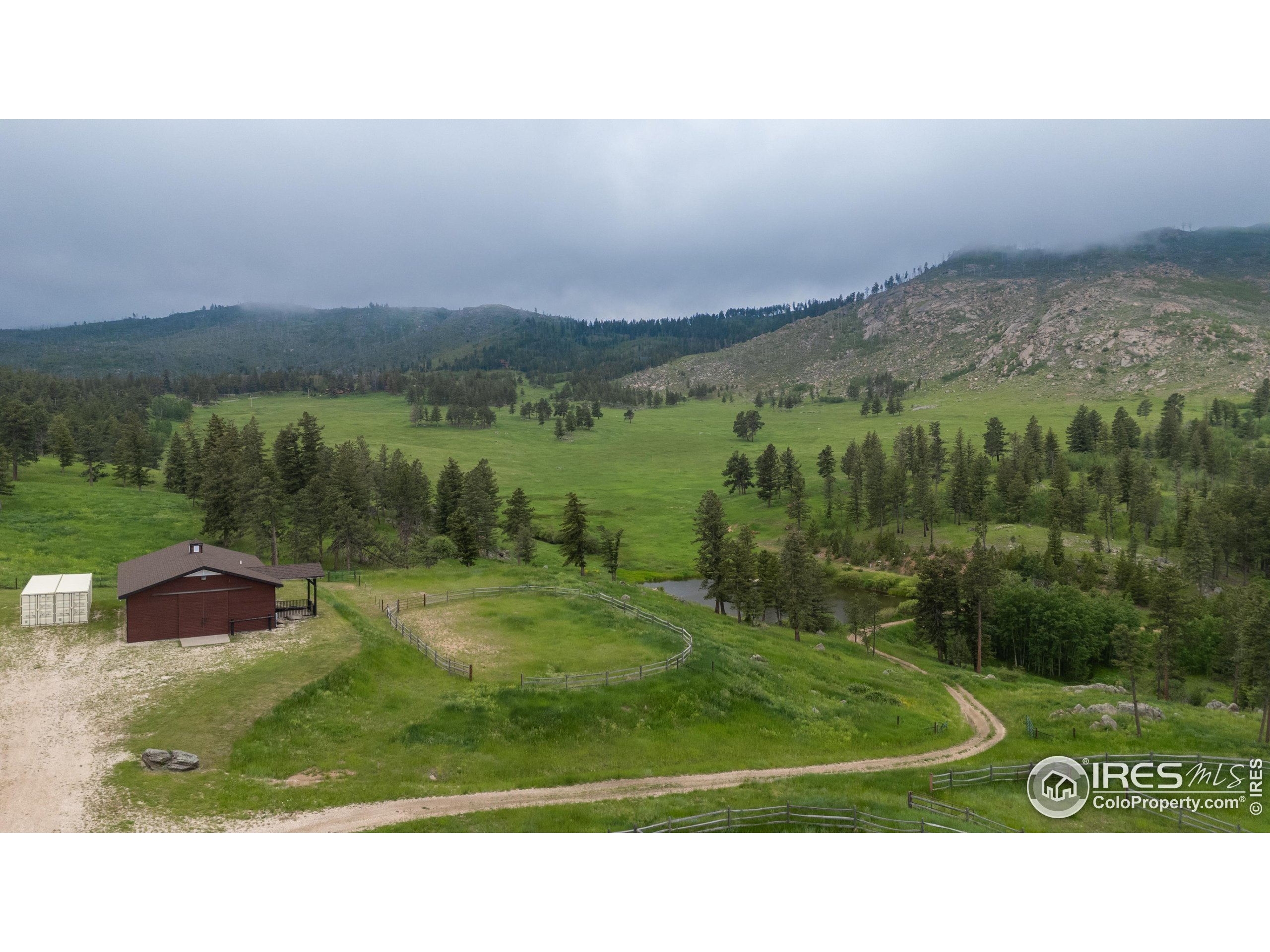 14884 Rist Canyon Road Bellvue, CO 80512 - Photo 23 of 40 a view of a lake with a yard