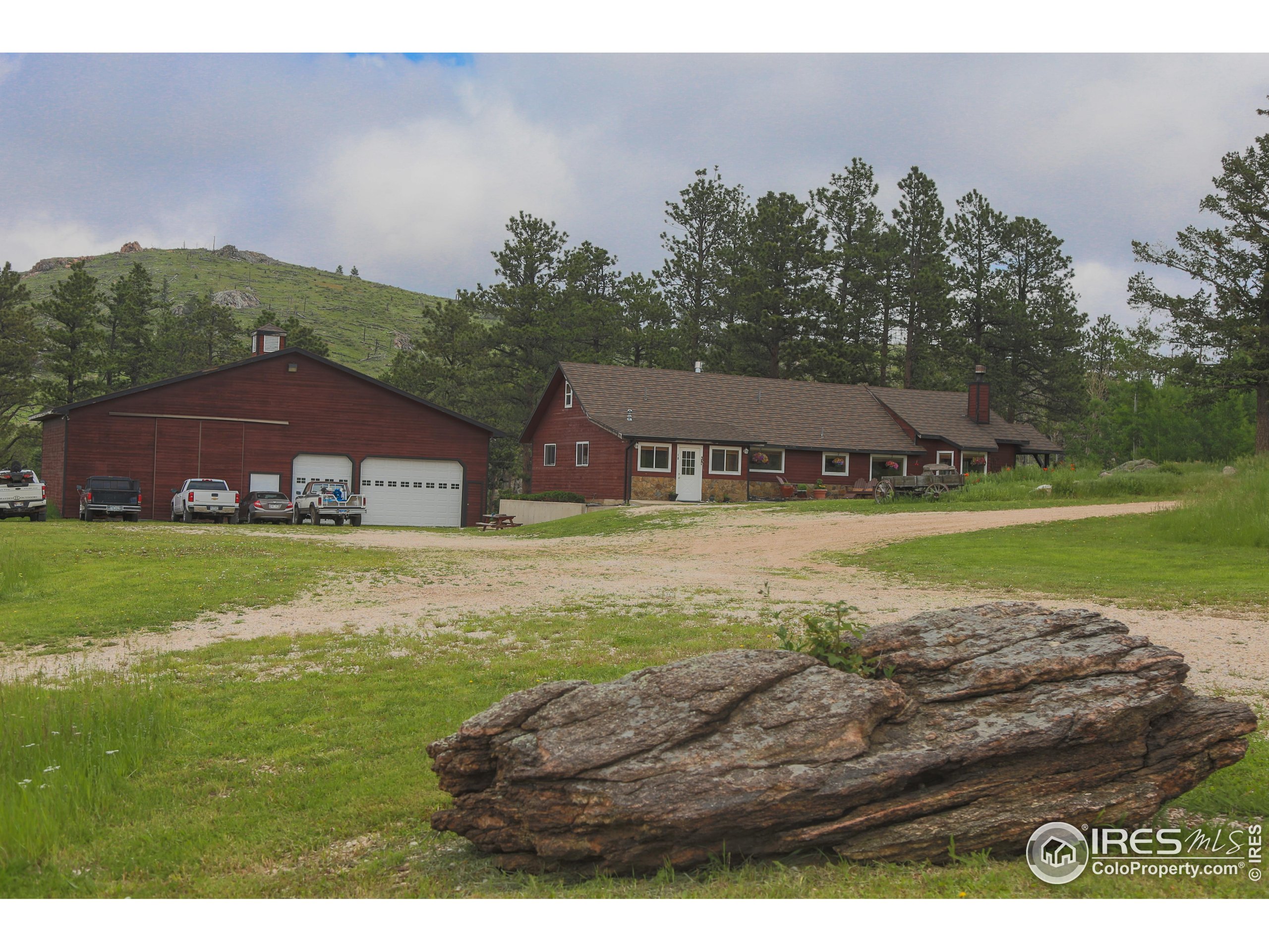 14884 Rist Canyon Road Bellvue, CO 80512 - Photo 10 of 40 a view of a house with a yard