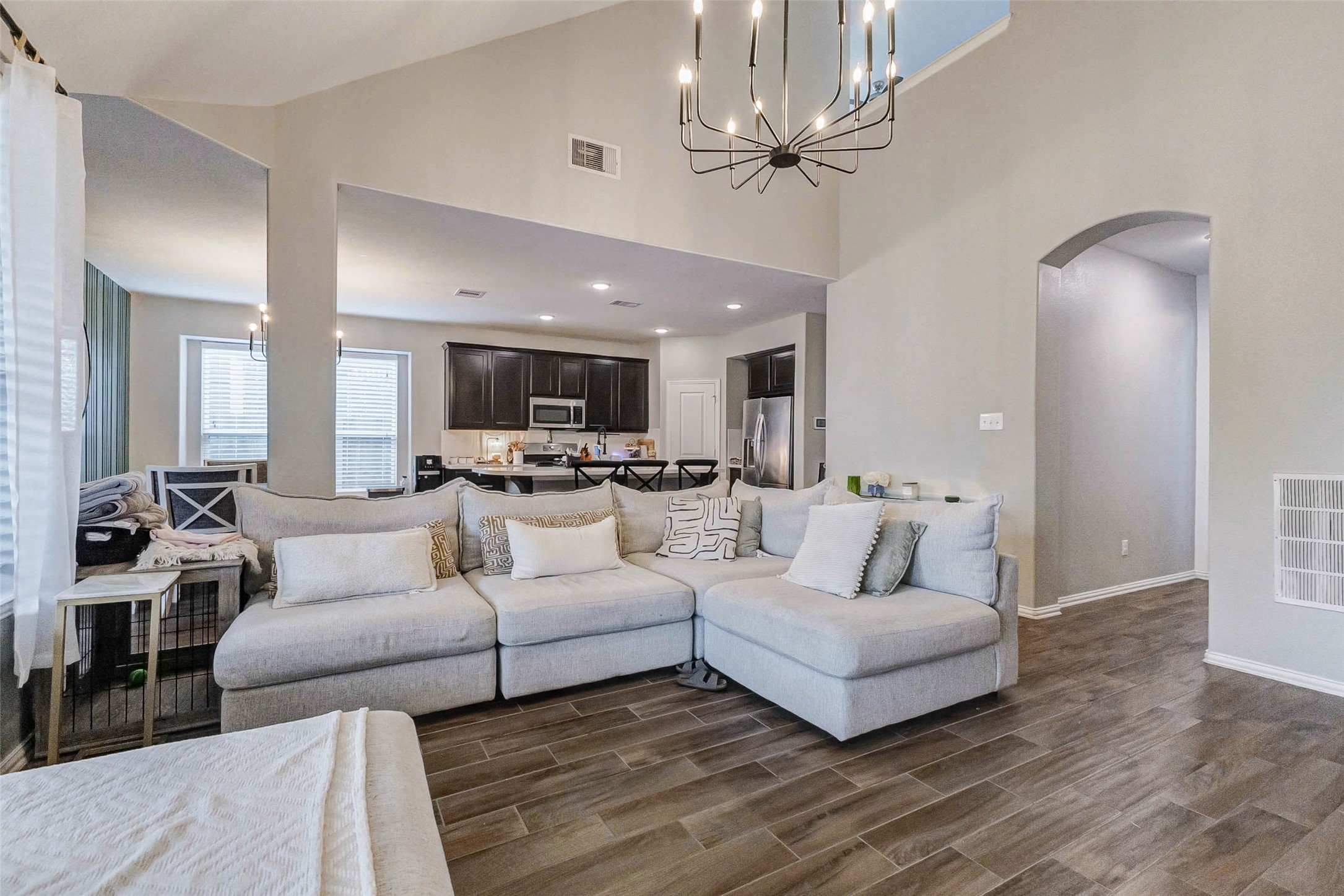 3210 Montclair Orchard Trace Spring, TX 77386 - Photo 11 of 38 a living room with furniture and a chandelier