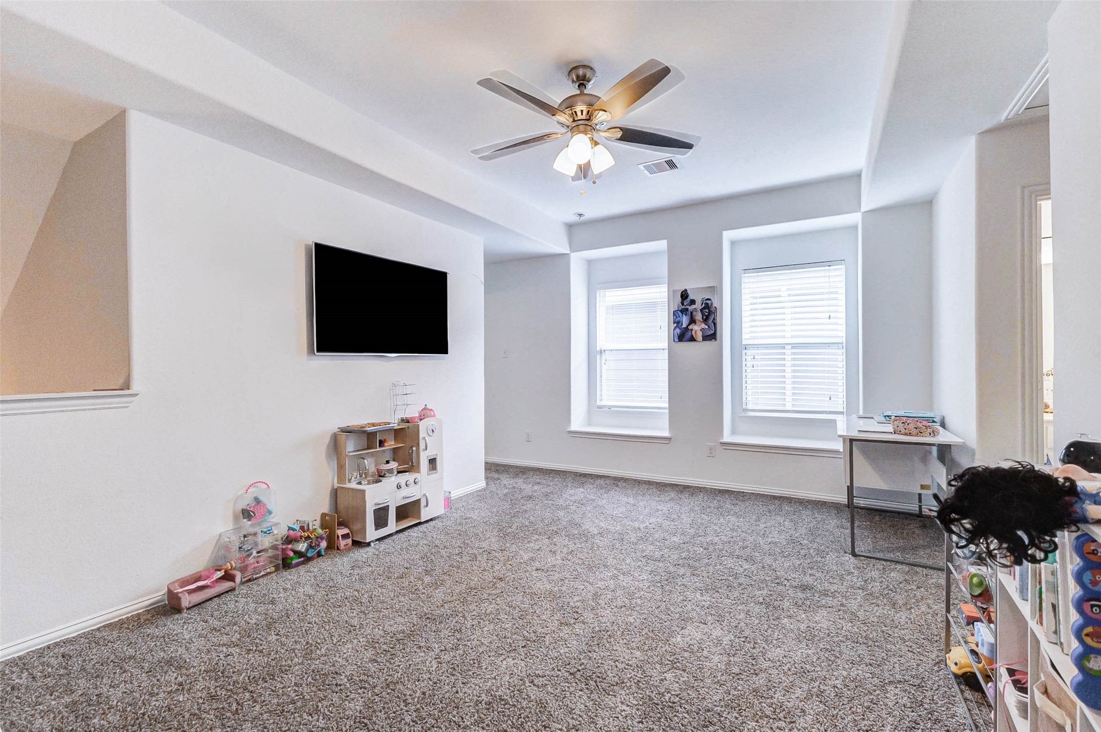 3210 Montclair Orchard Trace Spring, TX 77386 - Photo 19 of 38 a living room with furniture and a flat screen tv