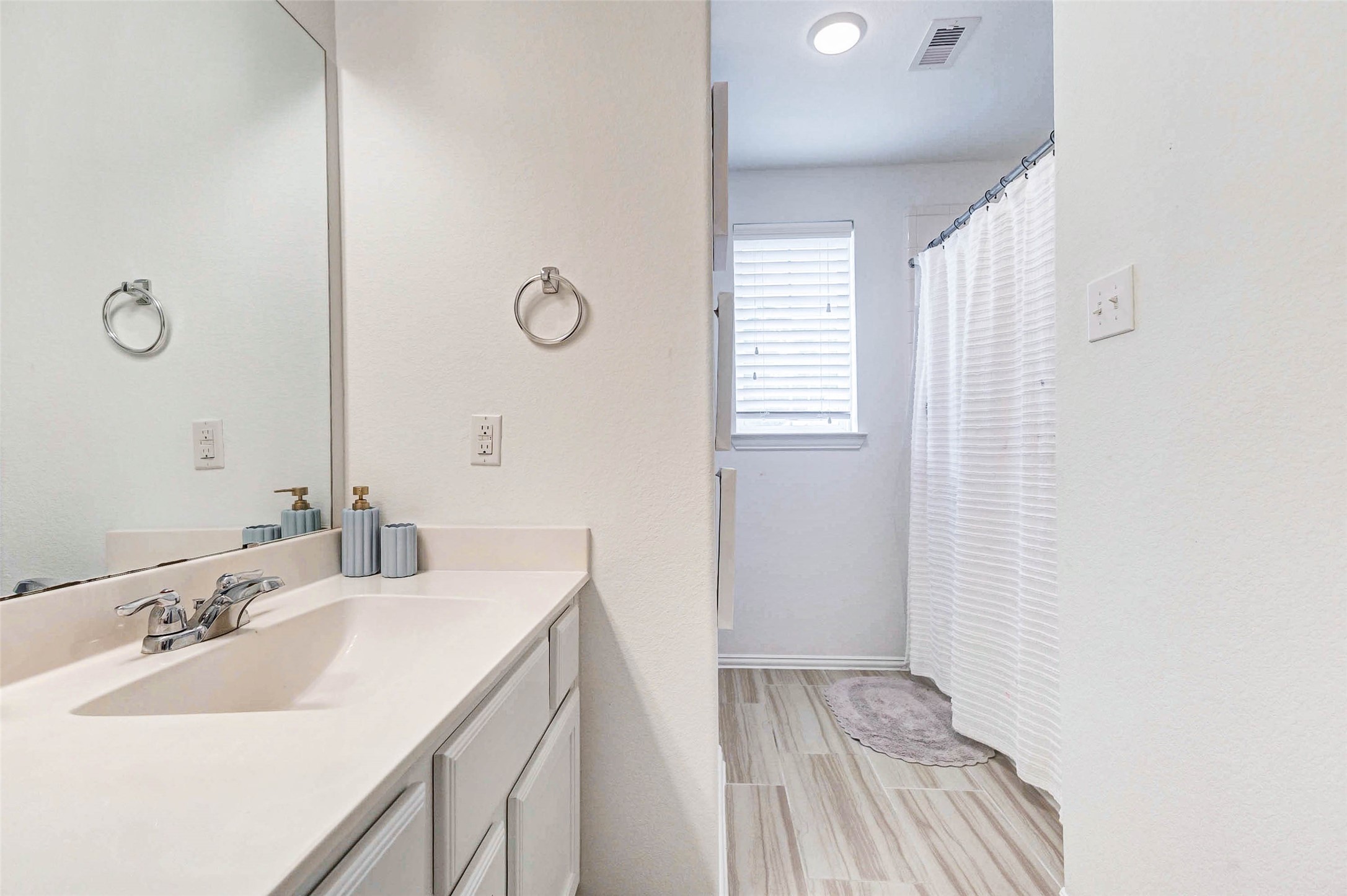3210 Montclair Orchard Trace Spring, TX 77386 - Photo 24 of 38 a bathroom with a sink and a mirror